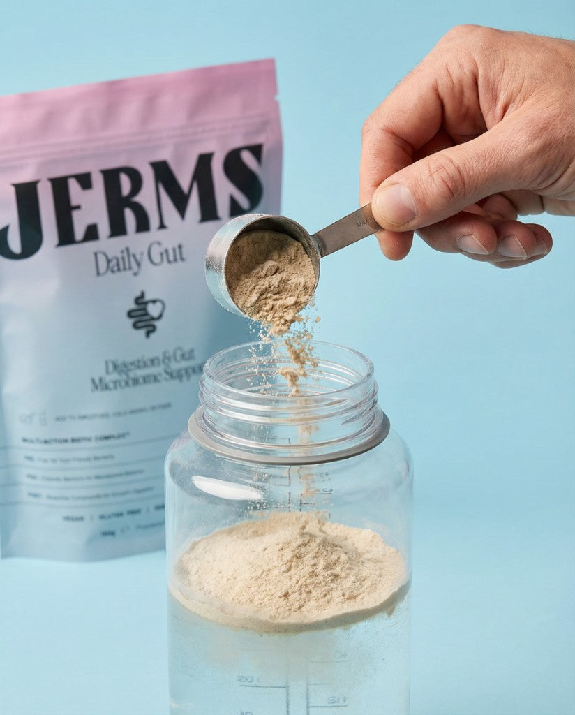 Scooping Daily Gut powder into water — simple daily ritual, no prescription or injections